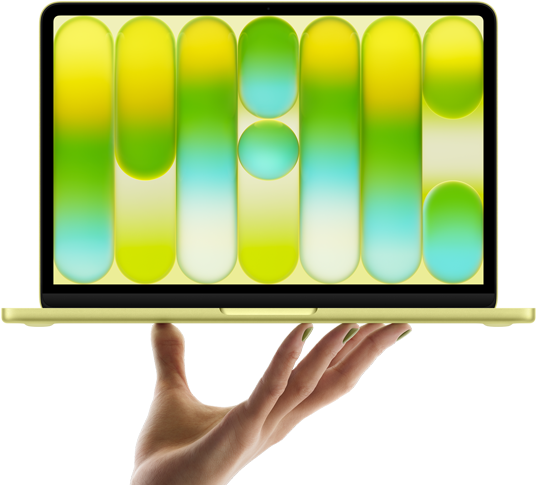MacBook Neo, Citrusinė spalvos, laikomas ant ištiestos rankos pirštų galiukų, ekrane matomas spalvingas abstraktus raštas
