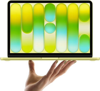 MacBook Neo, Citrusinė spalvos, laikomas ant ištiestos rankos pirštų galiukų, ekrane matomas spalvingas abstraktus raštas